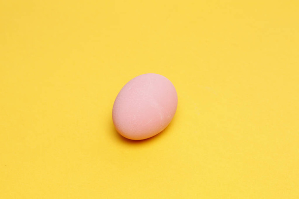 Preserved egg on yellow background - Photo, Image
