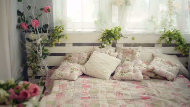 bed in the bedroom with flowers rustic style - Footage, Video