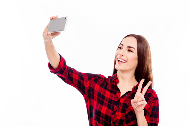 Selfie of happy cheerful young woman showing v-sign - Foto, immagini