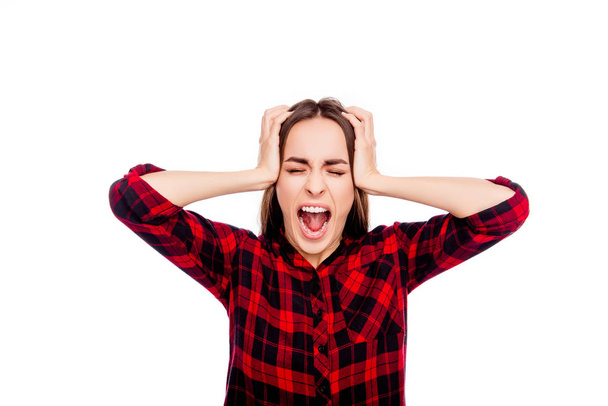 Portrait of frustrated angry young woman touching head and screa - Photo, Image