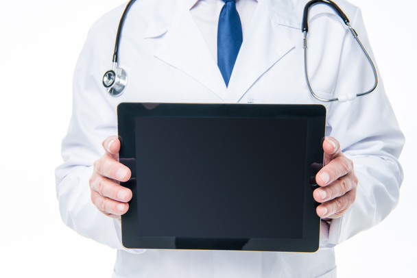 Doctor holding digital tablet - Фото, изображение