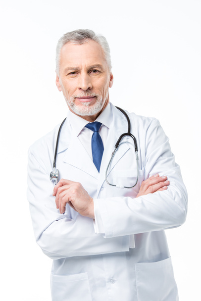 Mature doctor with stethoscope  - Photo, Image