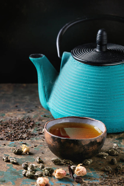 Variety of dry tea with teapot - 写真・画像