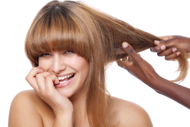 Smiling beauty getting her hair done - 写真・画像