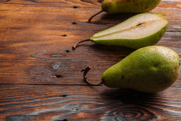 Fresh pears on the wooden background - Fotografie, Obrázek