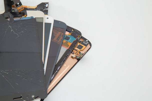 Broken mobile phone, parts and components - Фото, изображение