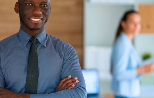 African-American Businessman over business office background - Foto, Bild