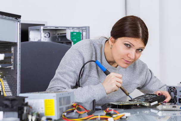 woman technician fixing computer motherboard - Foto, Bild