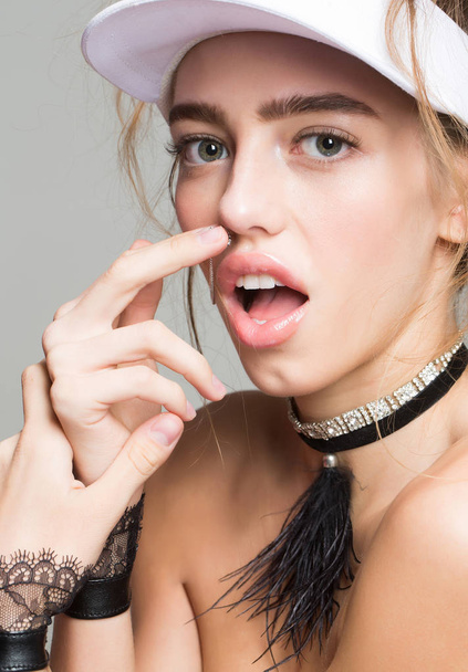 Pretty girl touches nose ring - Foto, immagini