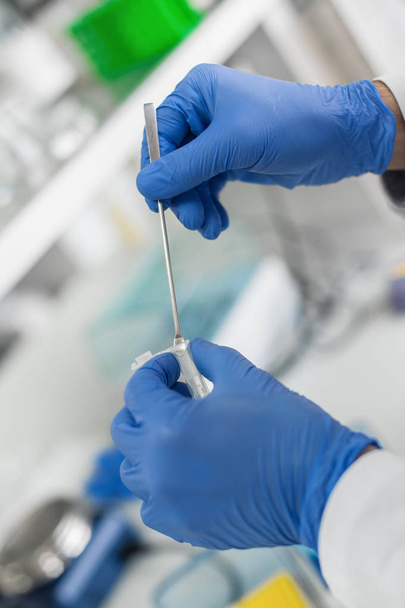 Laboratory technician take a sample with chemistry spoon - Fotografie, Obrázek