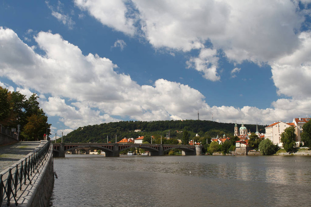 Vltava River in Prague. View from the embankment to the bridge a - Photo, Image