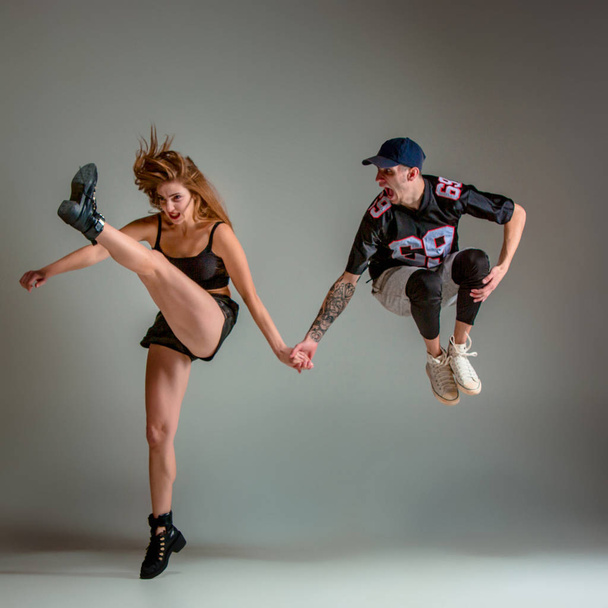 The two young girl and boy dancing hip hop in the studio - Foto, Imagem