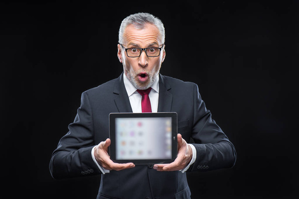 Businessman holding digital tablet - Photo, Image