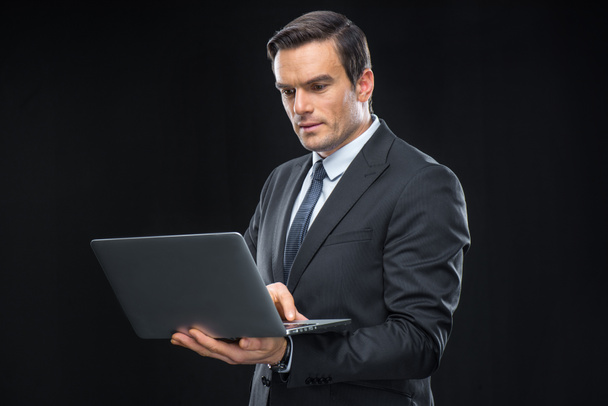Businessman using laptop - Photo, Image