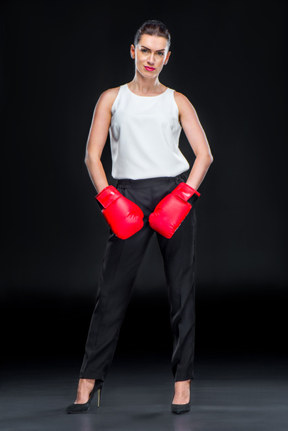 Businesswoman in boxing gloves - Фото, изображение
