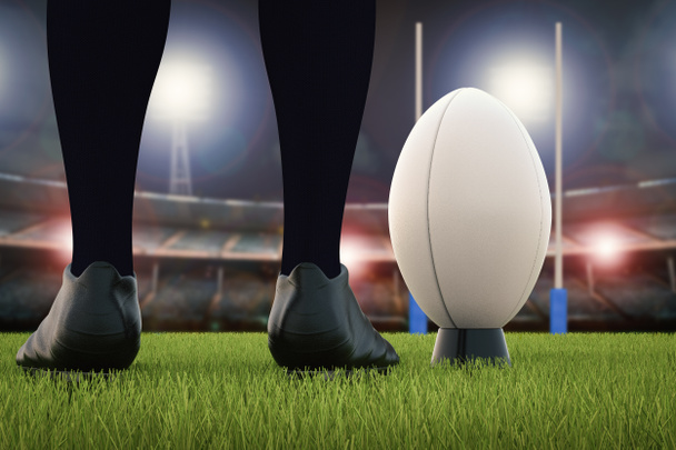 Rugby-Ball mit Rugbypfosten auf dem Feld - Foto, Bild