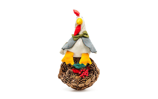 A basket of pine cones and a handmade cock - Foto, afbeelding