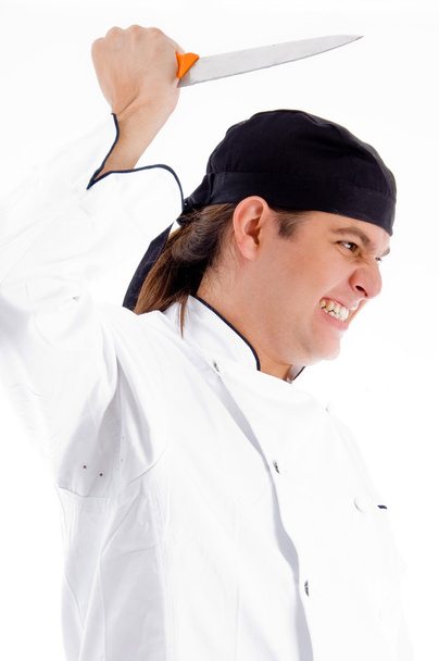 Dangerous young male chef with knife - Fotó, kép