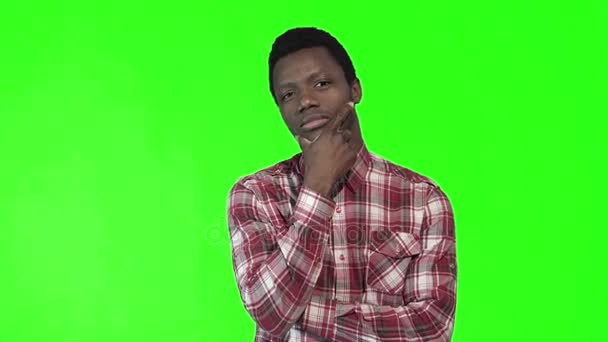 Young thoughtful man on chromakey background - Footage, Video