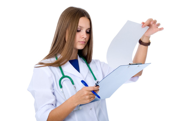 Portrait of a young doctor checking reports - Photo, image