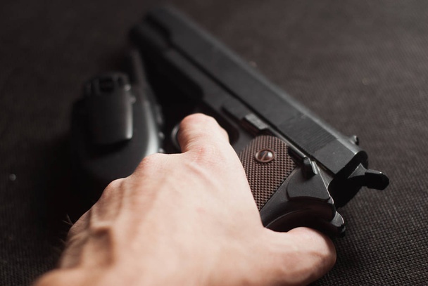 gun and  walkie-talkie on  black background, - Photo, Image