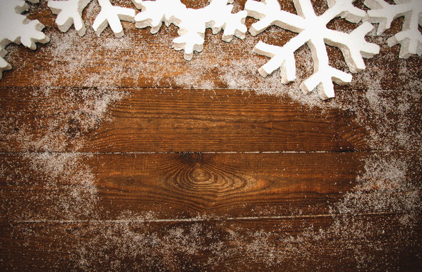 wood background with white snowflakes - Фото, изображение