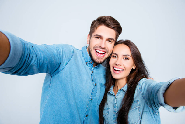 Portrait of attractive happy man and woman in love making selfie - Φωτογραφία, εικόνα