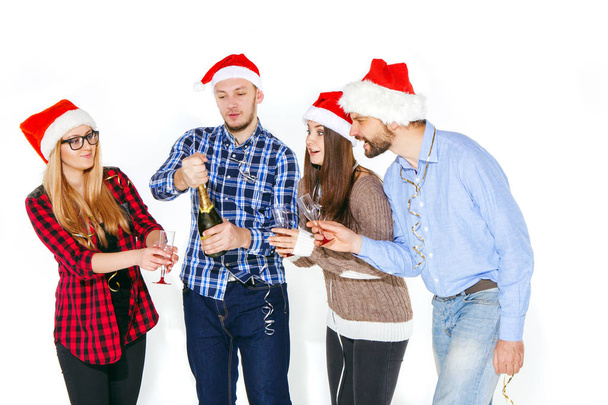 Many young women and men drinking at christmas party - Φωτογραφία, εικόνα
