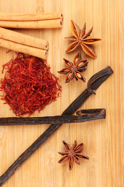 Fragrant spices on wooden background close-up - Фото, изображение