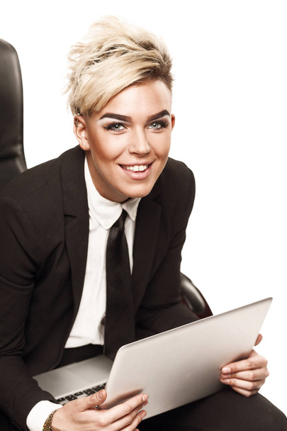 Blond beautiful business lady in black suit - Photo, image