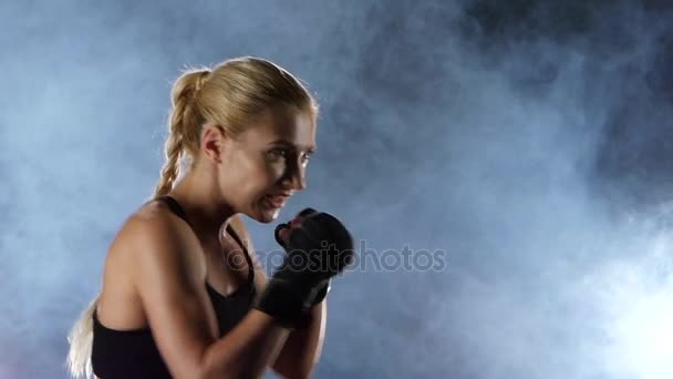 Slow motion. Training a boxer girl hands hit the target. - Video