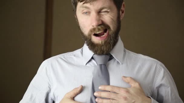 bearded business executive man yawning on a next day after a party - Materiał filmowy, wideo