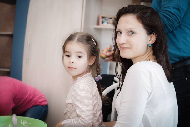 mother and daughter playing at home, portrait - Фото, зображення