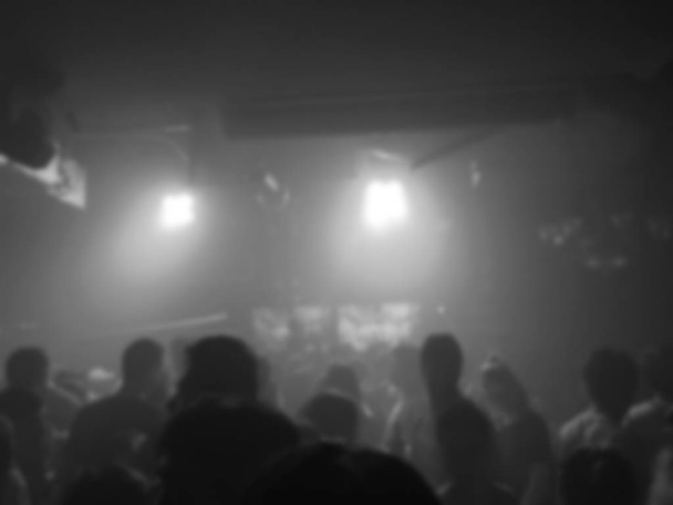 Crowd peoples dancing with DJ music in nightclub - Foto, Imagen