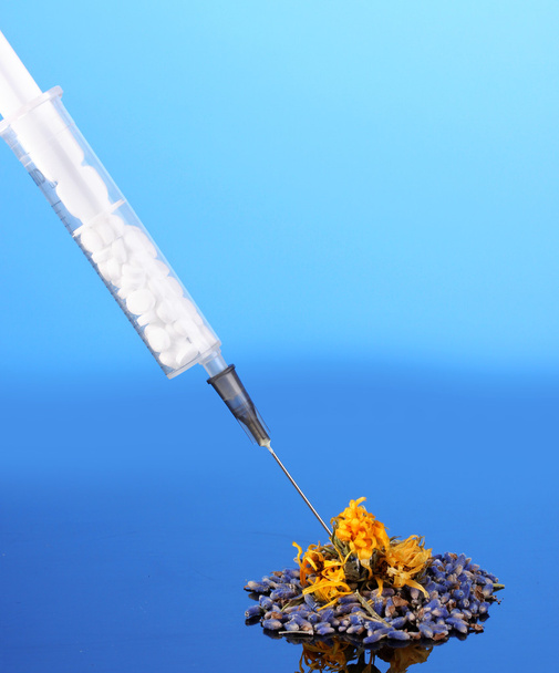 concept of homeopathy, on blue background close-up - Foto, immagini