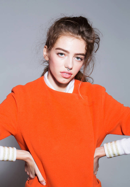 pretty fashionable girl in orange jacket - Fotó, kép