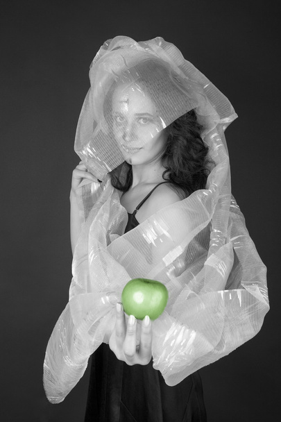 Two-faced woman with green apple tempt - Φωτογραφία, εικόνα