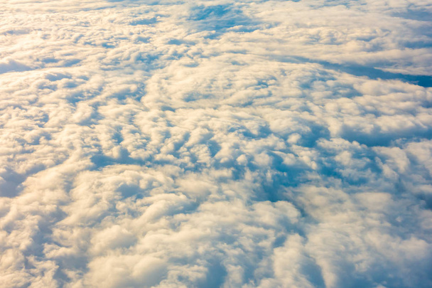 Sunrise above clouds from airplane window . - Fotoğraf, Görsel