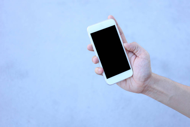 Smartphone en mano con pantalla de espacio en blanco
 - Foto, imagen