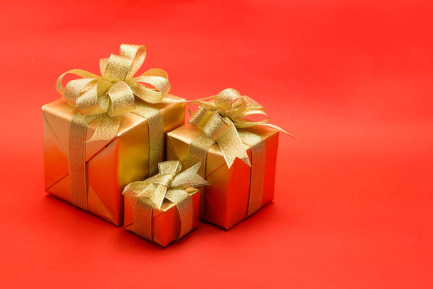 Christmas gift box on red background - Foto, Imagen
