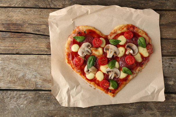 Tasty pizza in heart shape - Photo, Image