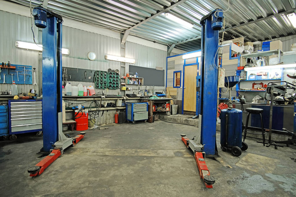 Empty workshop with a lift in a car repair station - Photo, Image
