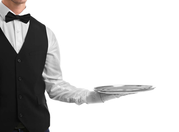 Waiter holding empty silver tray - Φωτογραφία, εικόνα