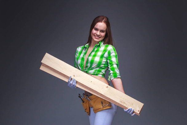 Portrait of young female construction carpenter  - Valokuva, kuva