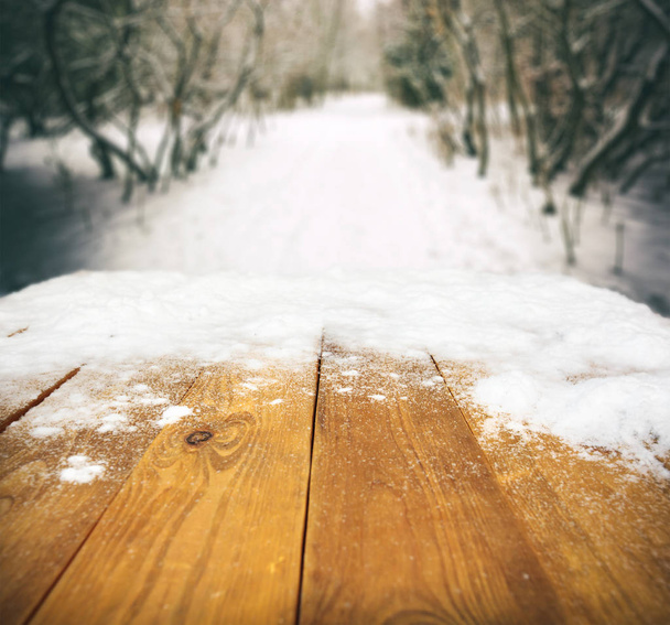 Wooden desk covered by snow - Foto, imagen