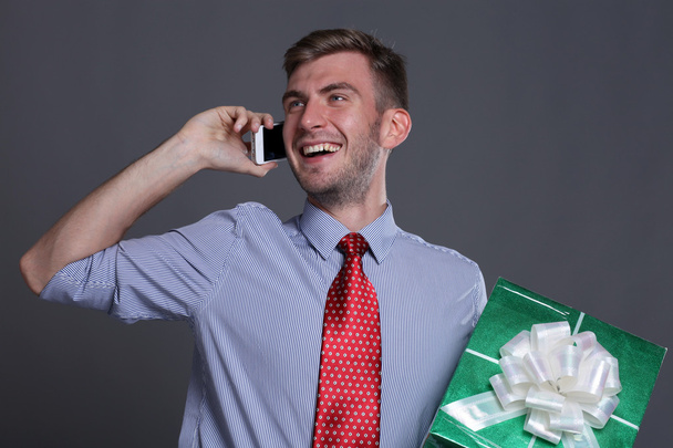 Portrait of young business man with gifts - Fotografie, Obrázek