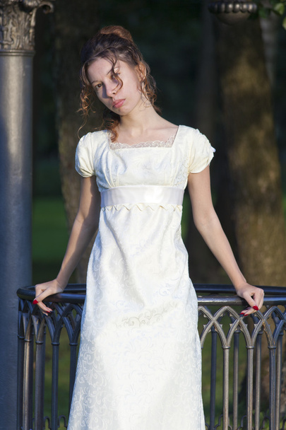 Young girl in a long white dress - Foto, imagen