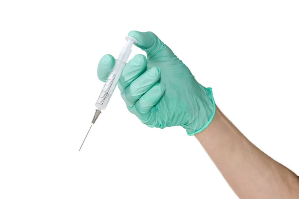 Seringa médica em uma mão masculina usando uma luva médica
  - Foto, Imagem