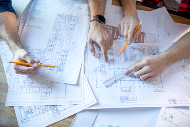 Architects discussing blueprints  - Photo, Image