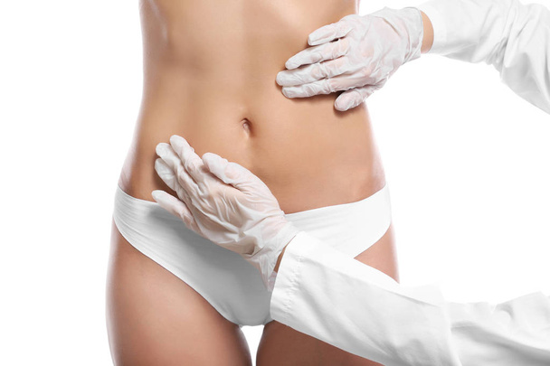 Surgeon examine female body - Foto, imagen